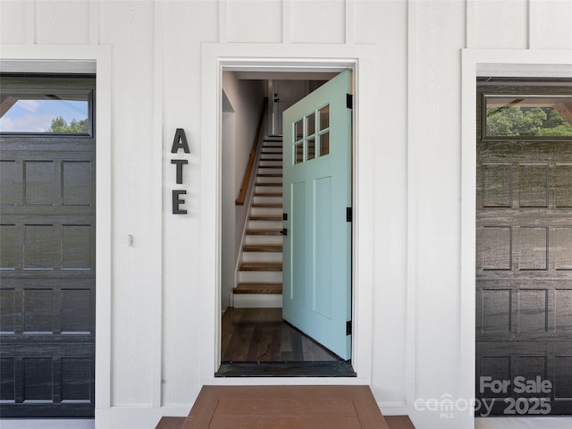 view of exterior entry featuring board and batten siding