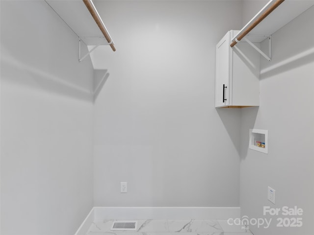 laundry area featuring marble finish floor, laundry area, hookup for a washing machine, and baseboards