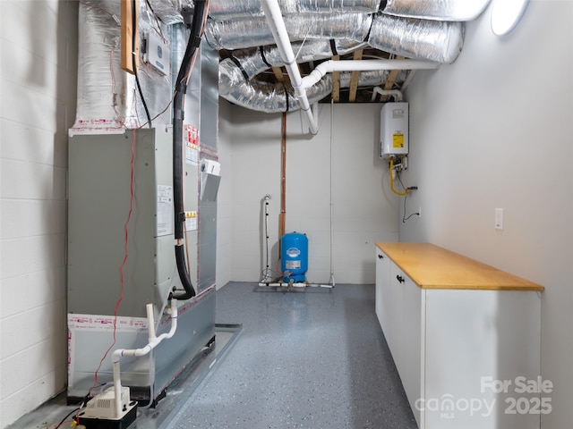 utility room with water heater and heating unit