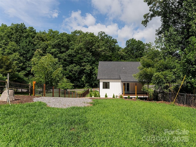 view of yard with fence and a wooden deck