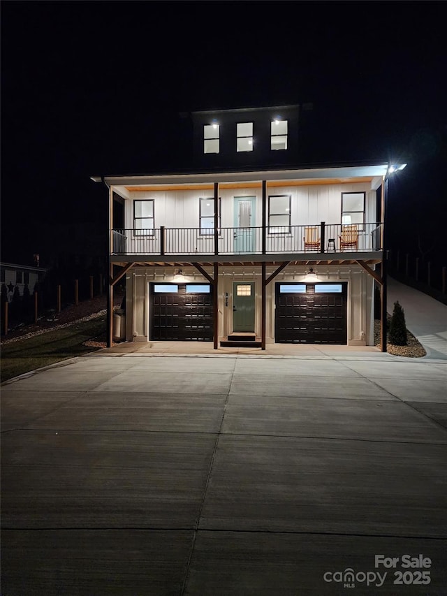 view of front of house with a garage and a balcony