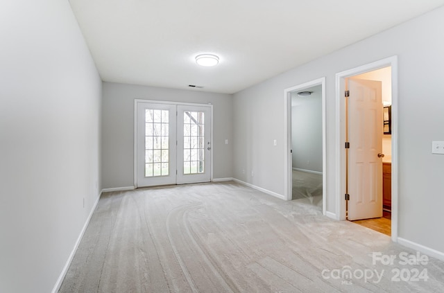 empty room featuring light carpet