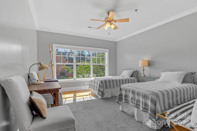 bedroom with ornamental molding, visible vents, ceiling fan, and baseboards