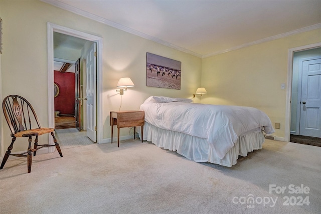 carpeted bedroom featuring ornamental molding