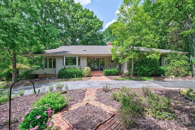 ranch-style home featuring a porch