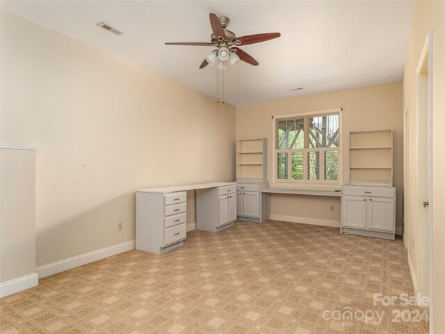 unfurnished office with ceiling fan