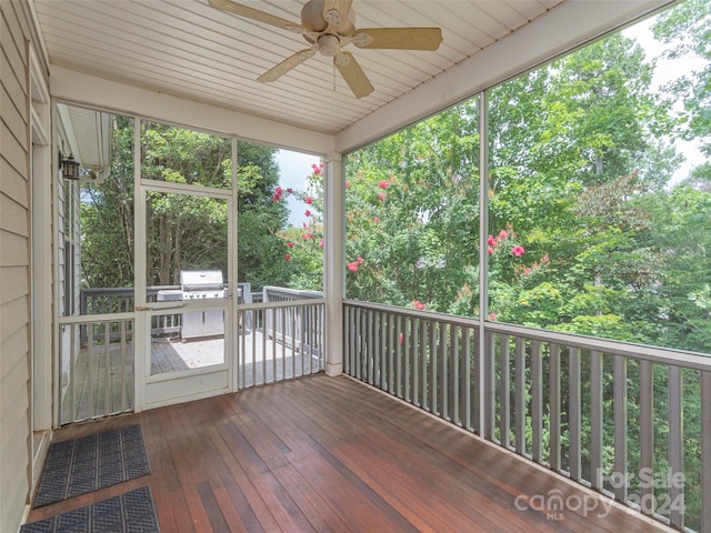 exterior space with ceiling fan