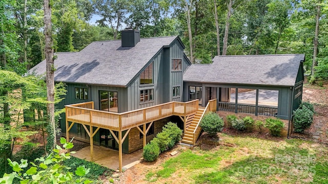 rear view of property with a deck