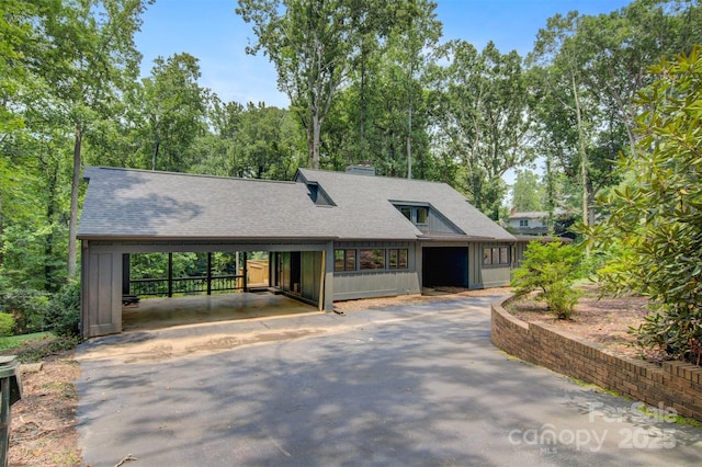 view of front facade with a carport and a garage