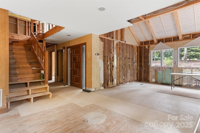 interior space with lofted ceiling with beams