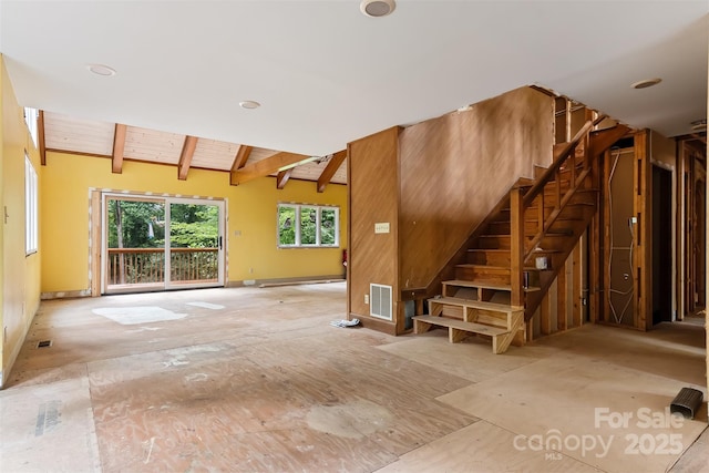 interior space with wooden ceiling and lofted ceiling with beams