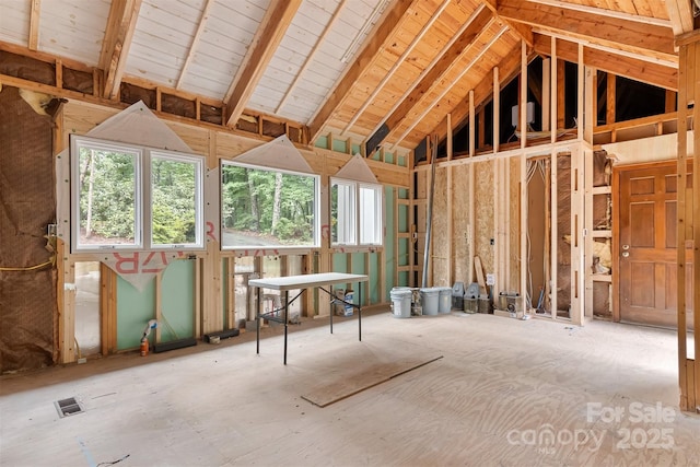 miscellaneous room featuring high vaulted ceiling