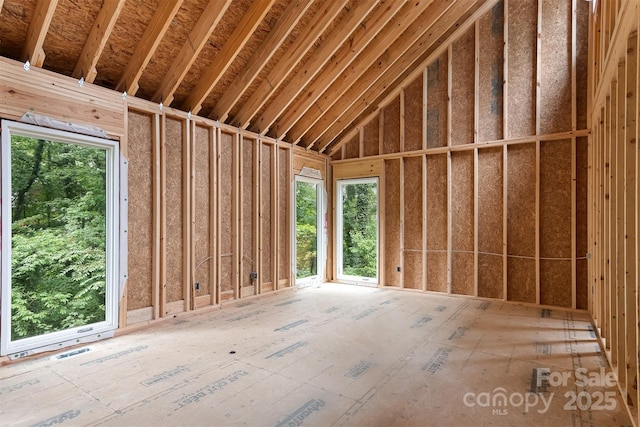 misc room with a high ceiling and plenty of natural light