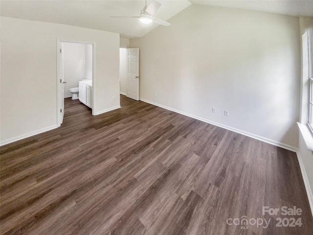 unfurnished bedroom with lofted ceiling, dark hardwood / wood-style flooring, ensuite bath, and ceiling fan