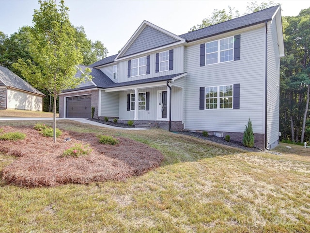1133 Heather Oak Ln, Oakboro, NC 28129 - view of front facade featuring a porch, an attached garage, concrete driveway, a front yard, and board and batten siding
