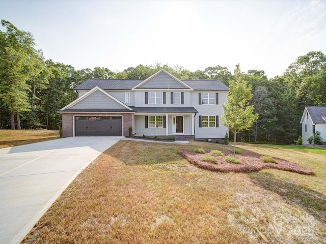 1133 Heather Oak Ln, Oakboro, NC 28129 - view of front of property featuring a porch, a garage, driveway, and a front yard