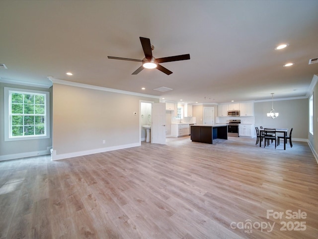 1133 Heather Oak Ln, Oakboro, NC 28129 - unfurnished living room featuring ornamental molding, recessed lighting, baseboards, light wood-style floors, and a chandelier