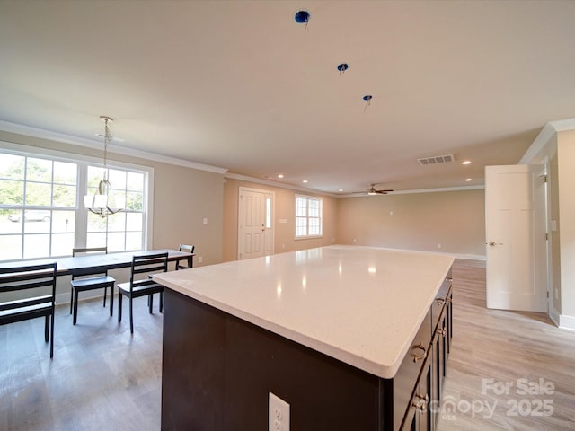 1133 Heather Oak Ln, Oakboro, NC 28129 - kitchen featuring crown molding, light wood-style floors, a kitchen island, recessed lighting, and ceiling fan
