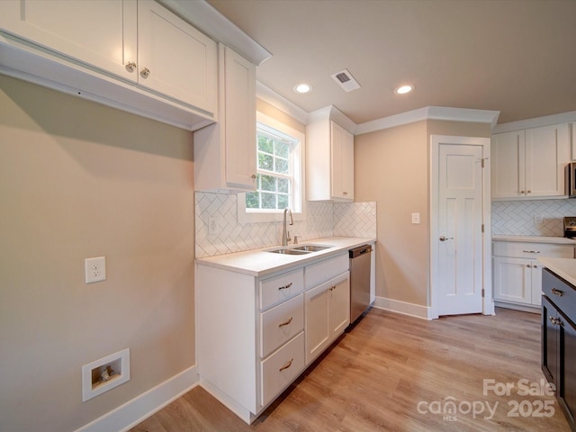 1133 Heather Oak Ln, Oakboro, NC 28129 - kitchen featuring a sink, stainless steel appliances, backsplash, white cabinets, and recessed lighting