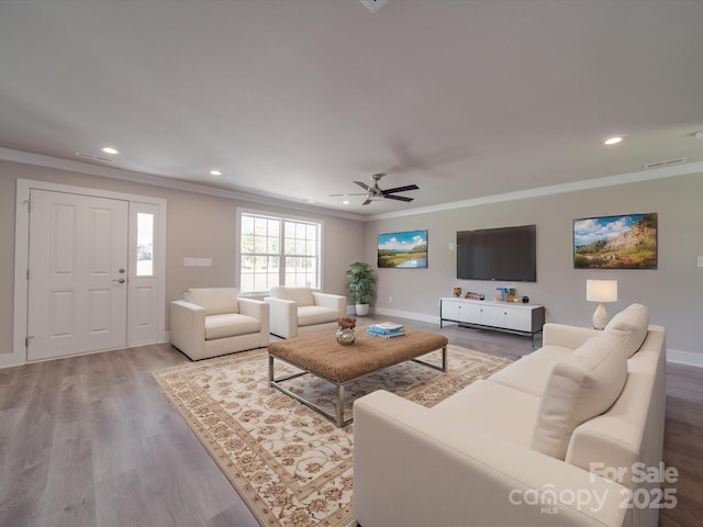 1133 Heather Oak Ln, Oakboro, NC 28129 - living area featuring crown molding, wood finished floors, recessed lighting, and ceiling fan
