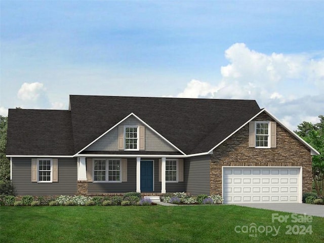 view of front of house featuring a garage, driveway, and a front yard