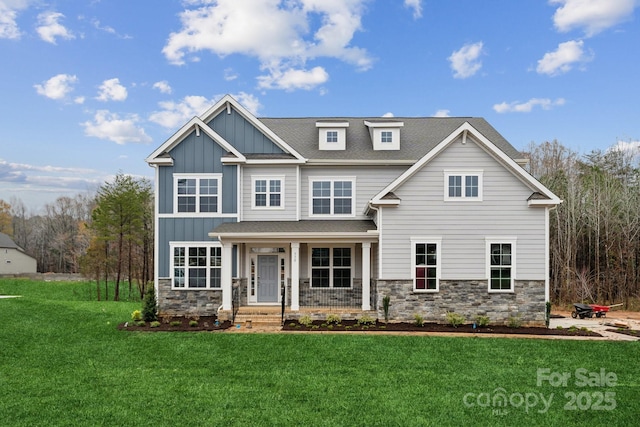 craftsman-style home featuring a front yard