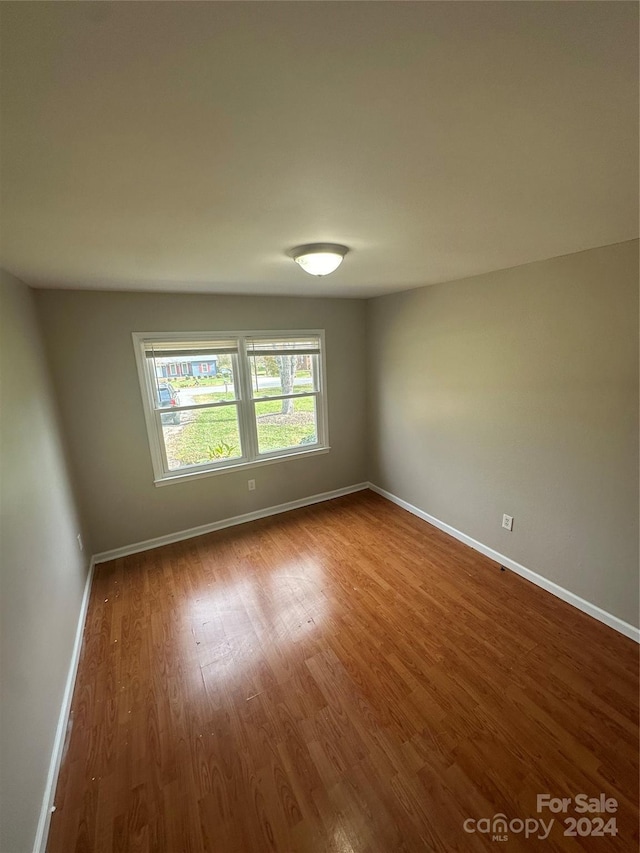 empty room featuring wood-type flooring