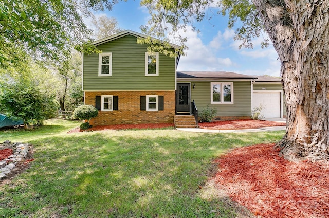 split level home with a garage and a front lawn