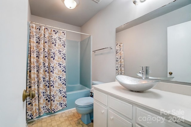 full bathroom with vanity, tile patterned floors, shower / bath combo, and toilet