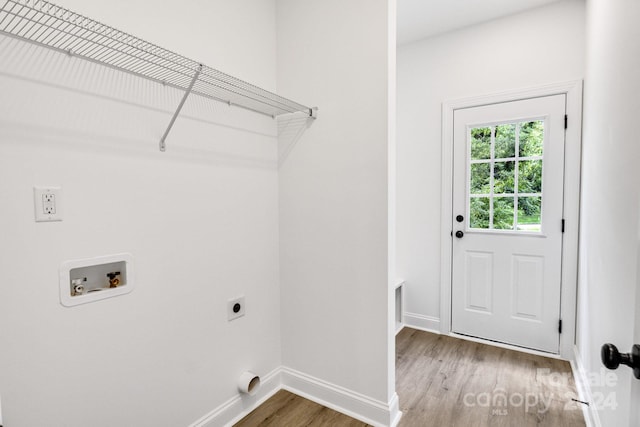 washroom with hardwood / wood-style floors, hookup for a washing machine, and hookup for an electric dryer