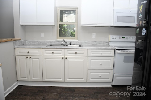 kitchen with sink, dark wood-type flooring, white appliances, and white cabinetry