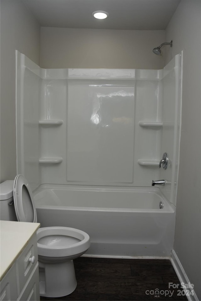 full bathroom with vanity, toilet, shower / tub combination, and hardwood / wood-style floors