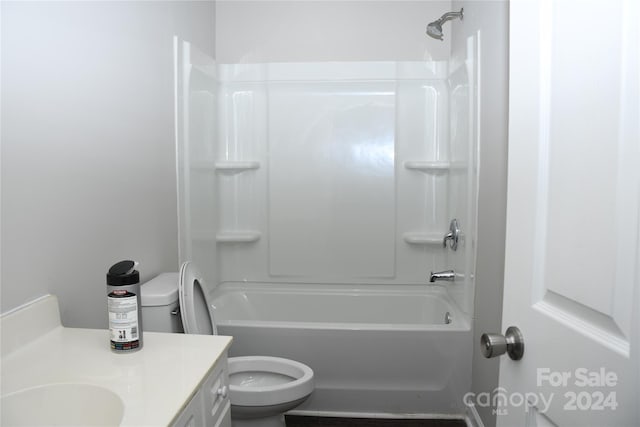 full bathroom featuring bathing tub / shower combination, vanity, and toilet