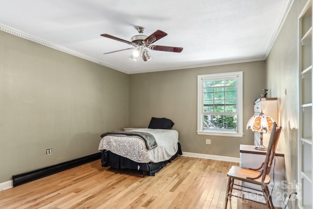 bedroom with ceiling fan, ornamental molding, and light hardwood / wood-style flooring