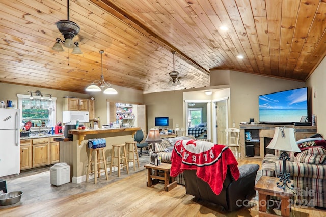 living room with vaulted ceiling, wood ceiling, light hardwood / wood-style floors, ceiling fan, and ornamental molding