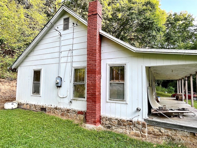 view of property exterior featuring a lawn