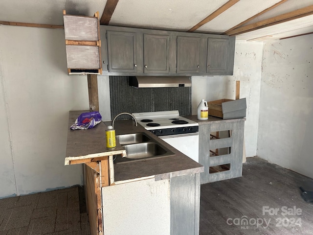 kitchen featuring beam ceiling, exhaust hood, dark wood-type flooring, white range with electric stovetop, and sink