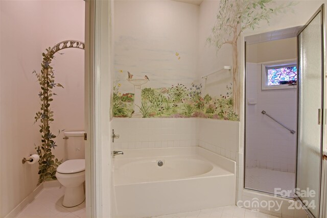 bathroom with tile patterned floors, plus walk in shower, and toilet