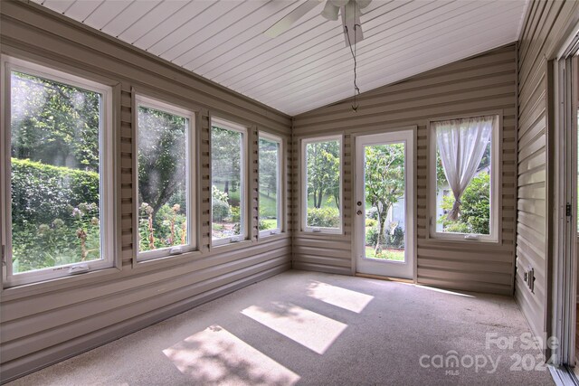 unfurnished sunroom featuring lofted ceiling and ceiling fan