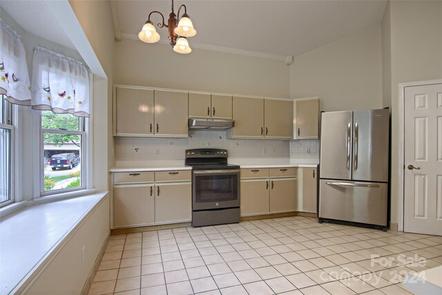 kitchen with tasteful backsplash, light tile patterned flooring, range with electric cooktop, and stainless steel refrigerator