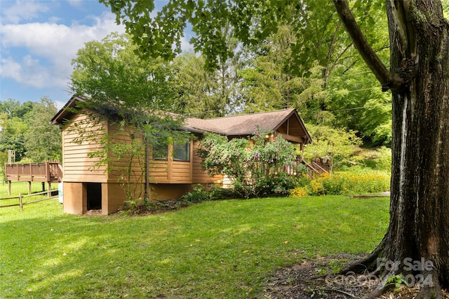 view of yard featuring a wooden deck