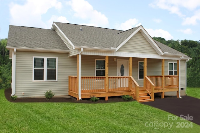 view of front of home with a porch and a front lawn