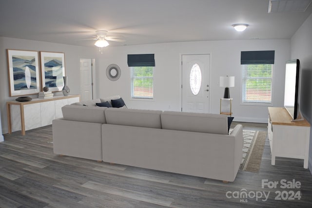 unfurnished living room with hardwood / wood-style flooring and ceiling fan