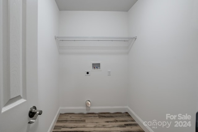 clothes washing area featuring washer hookup, hookup for an electric dryer, and wood-type flooring