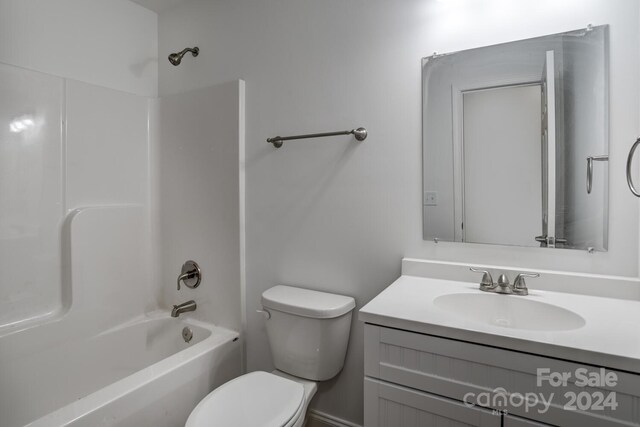 full bathroom featuring  shower combination, toilet, and vanity