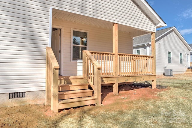 back of house featuring central AC unit