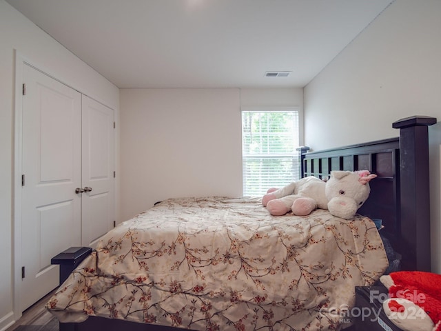 bedroom featuring visible vents