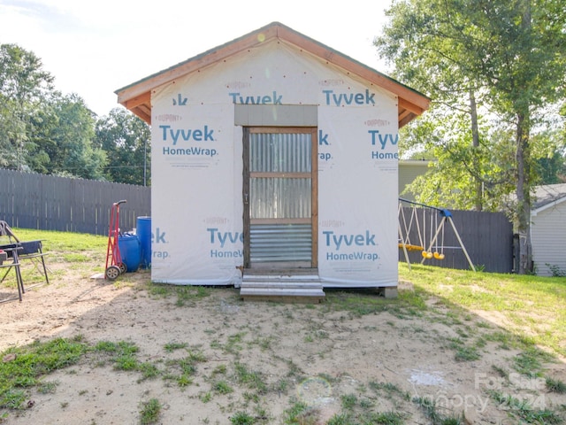 view of outdoor structure with fence