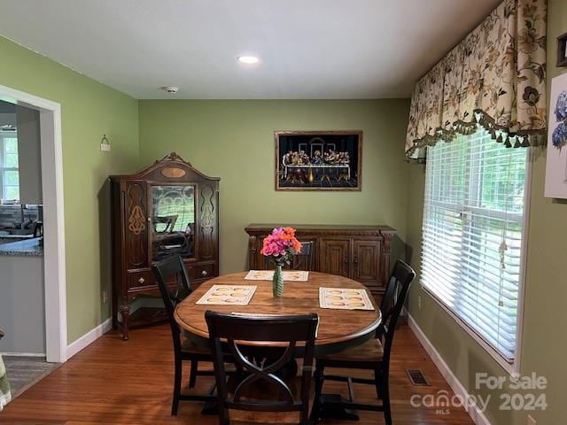 dining area with wood-type flooring