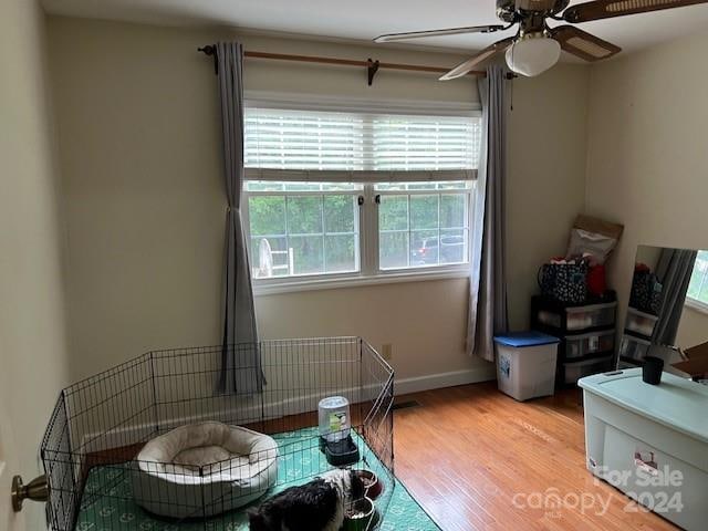 sitting room with light hardwood / wood-style flooring and ceiling fan